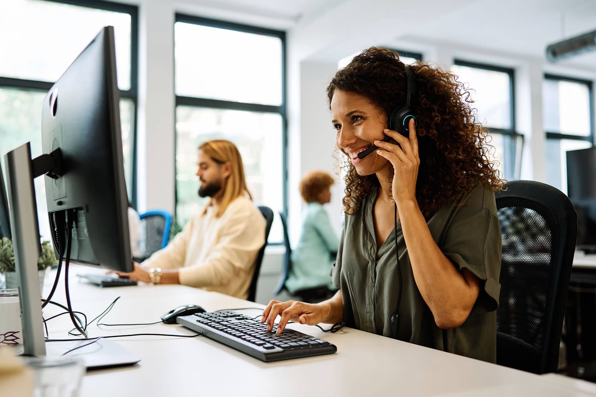 Woman sits in a call center